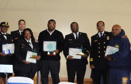 Children’s National Medical Center’s Dr. Joseph Wright (far left), F&EMS Medical Director Dr. David Miramontes (third from left), F&EMS Chief Kenneth Ellerbe (third from right) and Acting F&EMS Operations Chief Gerald Coles (far right) congratulate some of the Department’s EMS Week award